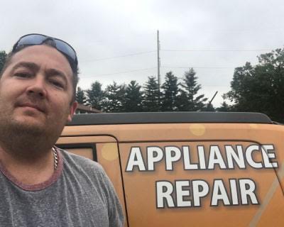 Man posing with the TJ's Appliance Repair van