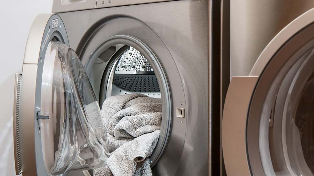 A clothes dryer full of clean towels